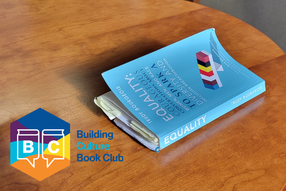 blue book sitting on a table on right and logo in bottom, left corner with words "Building Culture Book Club"